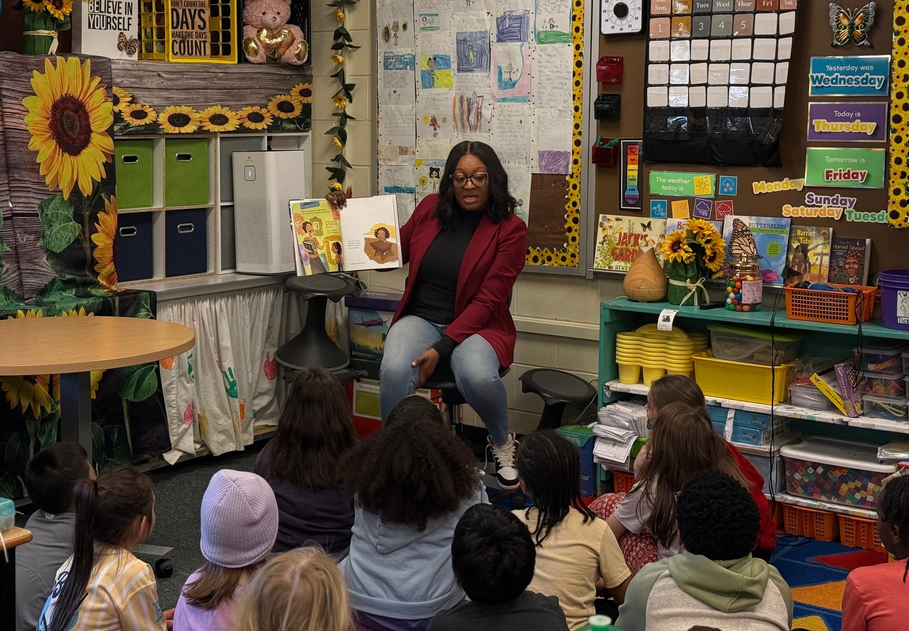Senator Anthony reading to a classroom of children