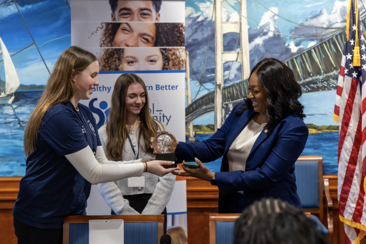 Sen. Anthony receives the Legislative Award from representatives of the School-Community Health Alliance of Michigan. 