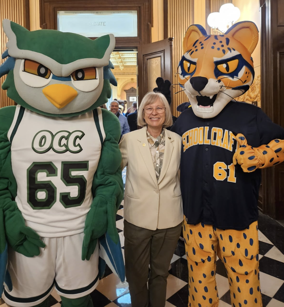 Sen Bayer joined by mascots from Oakland Community College and Schoolcraft College in the capitol building