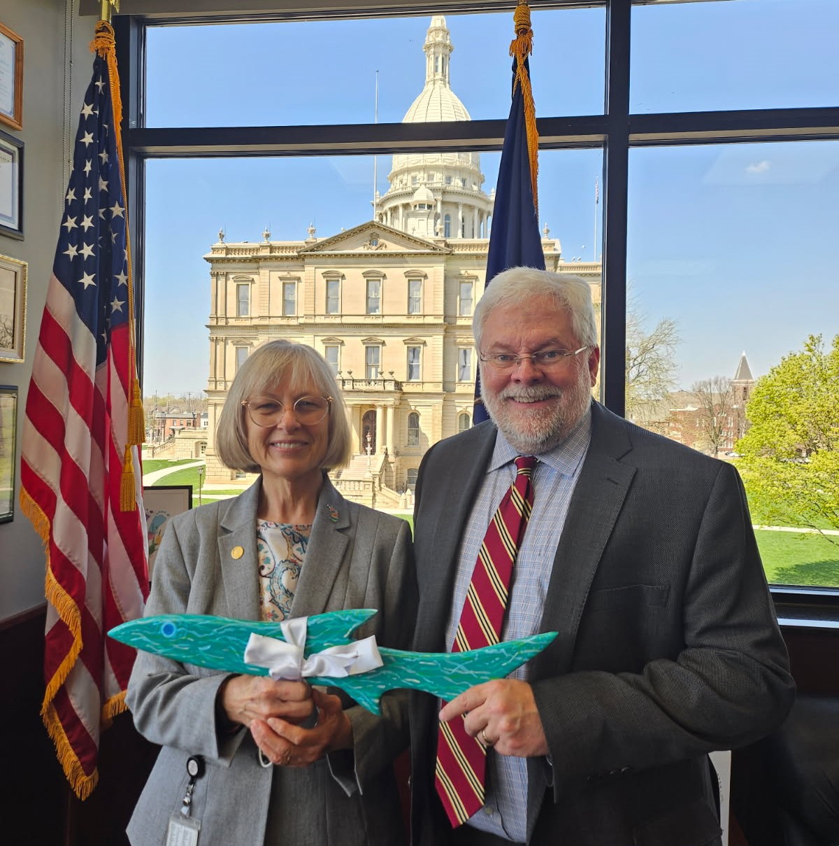 Senator Bayer and a member of the Huron River Watershed Council. Sen Bayer is being presented the Legislator of the Year award