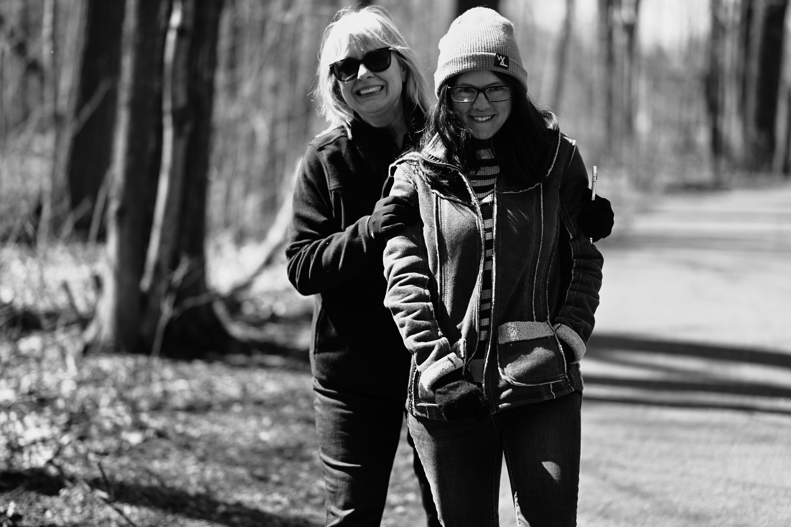 Sen. Bayer pictured with her daughter, above. They are in the woods smiling