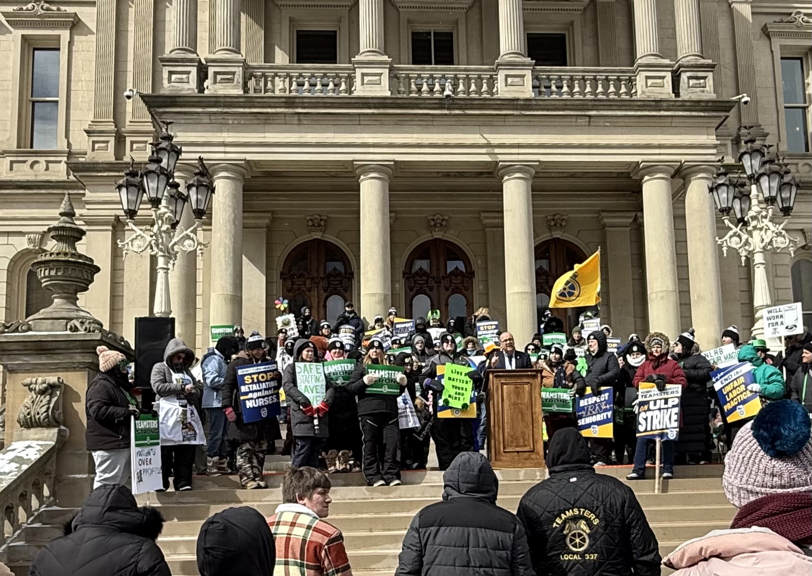 Seantor Cherry standing with striking nurses on the captiol steps