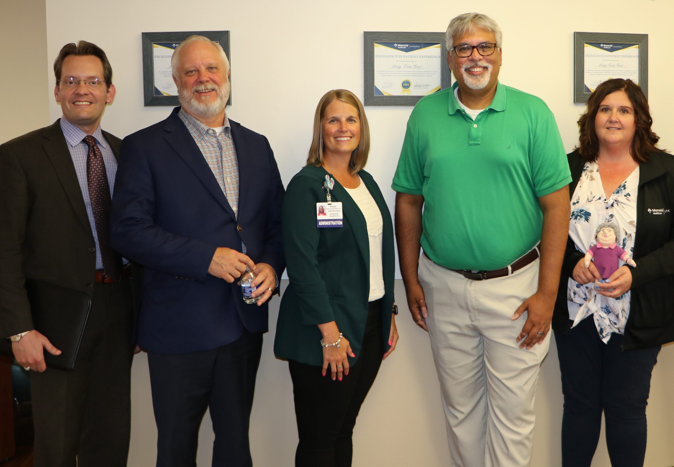 Sen. Singh standing alongside Memorial Healthcare staff. Pictured from left to right: Ben Frederick, Associate Vice President of Advocacy and Government Relations, Brian Long, President and CEO, Megan Smith, Chief Nursing Officer/VP of Patient Care Services, Sen. Singh, and Jaime Abudaya, Director of Nursing/Skilled Nursing Facility Administrator.