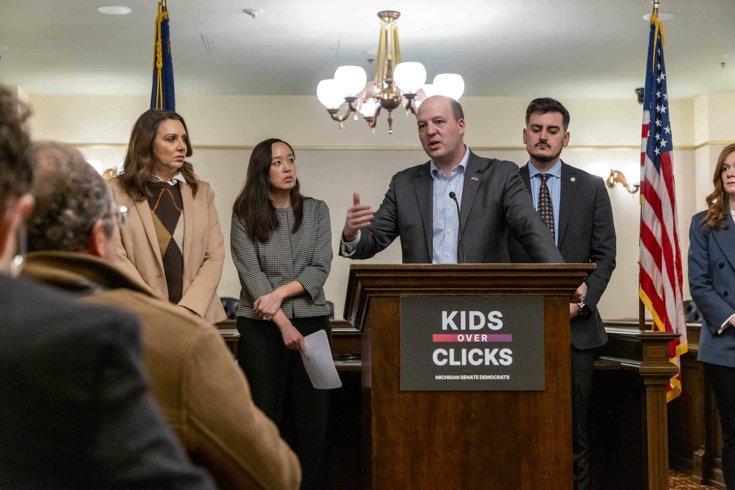 Senator Hertel speaks at a podium at the Kids Over Clicks press conference