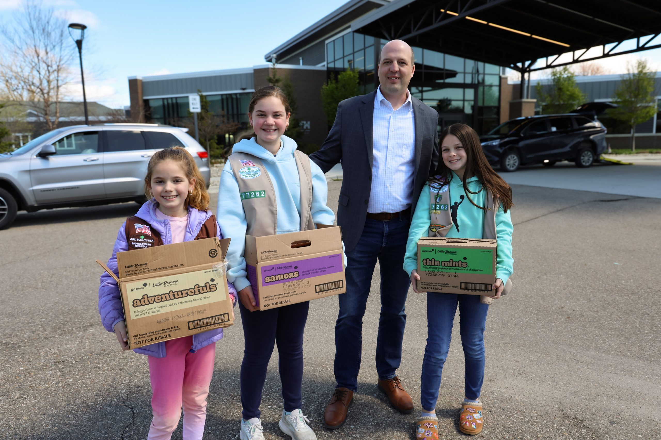 Sen Hertel with a local Girl Scout troop delivering cookies to a Chesterfield Veterans Home