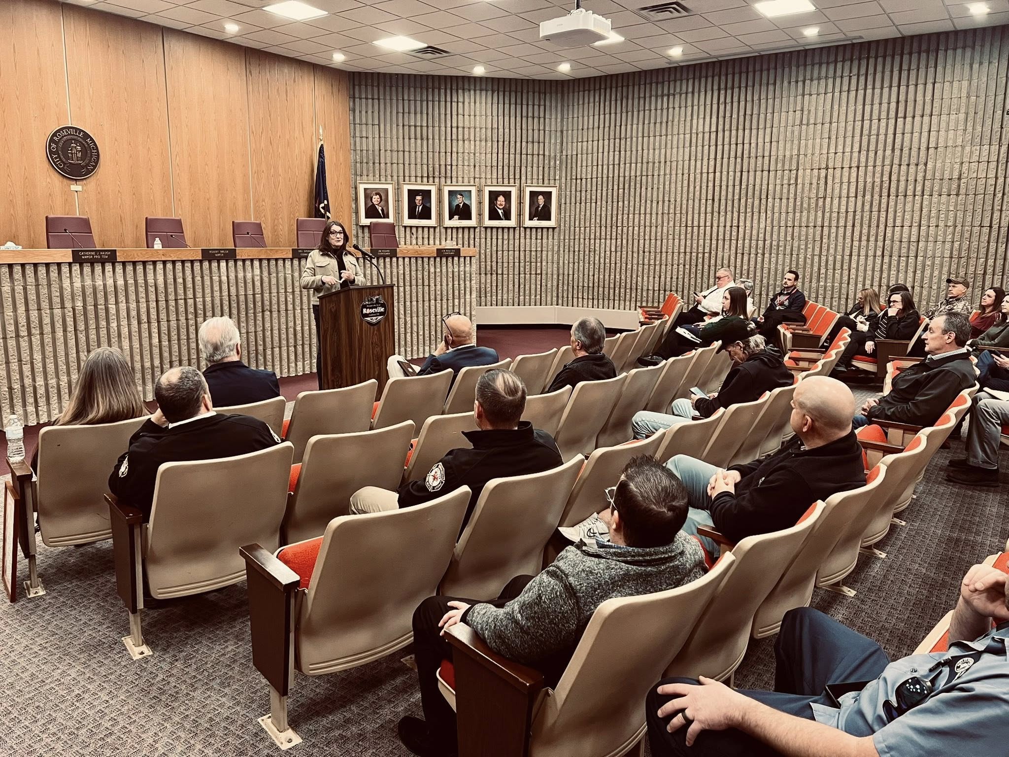 Sen Klinefelt speaking at a podium to residents of the City of Roseville