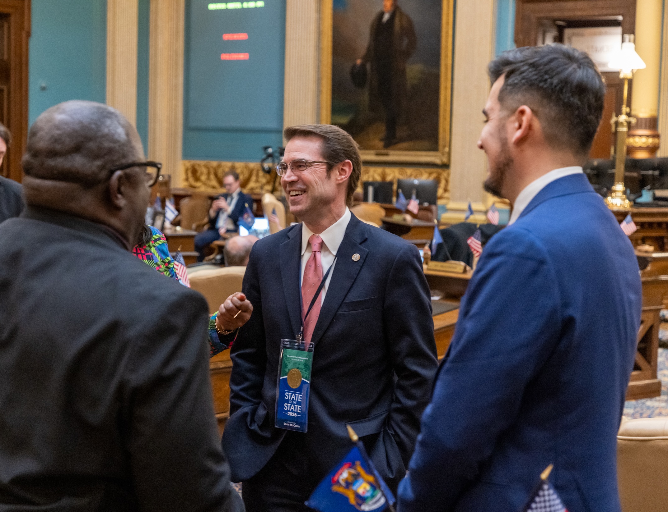 Senator McCann speaking with other legislators at State of the State