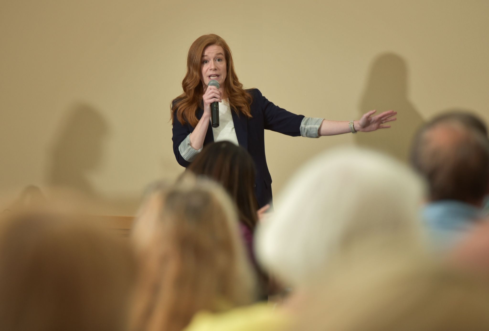 Sen McMorrow at a town hall discussing the recent reckless budget<br />
cuts happening at the federal<br />
level, and how they affect<br />
communities around Michigan into a microphone