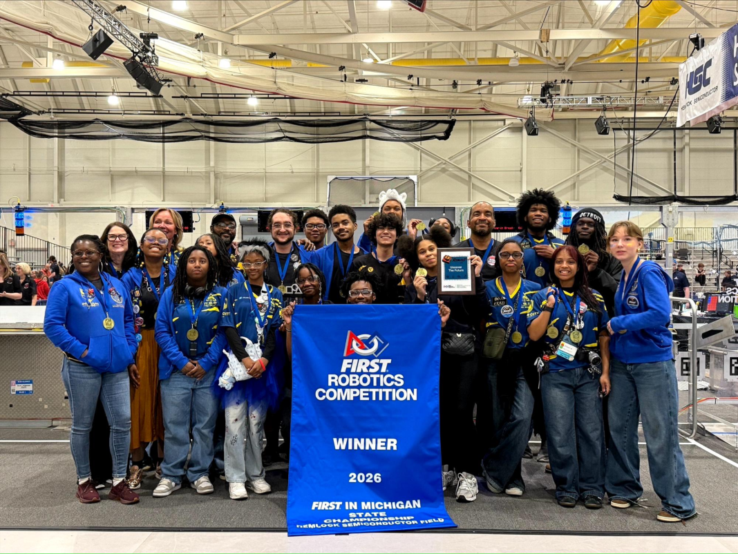 Marygrove Robotics Team at the World Championship competition standing in front of the 2026 Winner sign