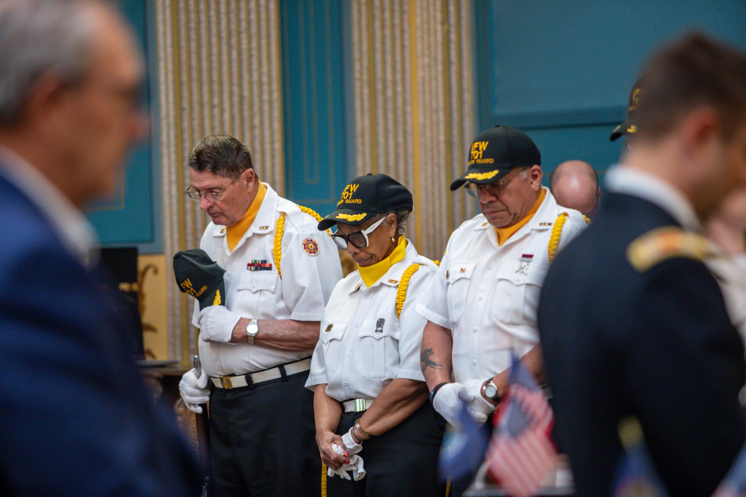 Senate Memorial Day service. Service members with their heads bowed
