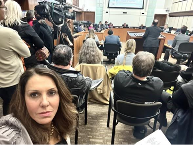 Senator Polehanki preparing to testify before the Washtenaw County Commission
