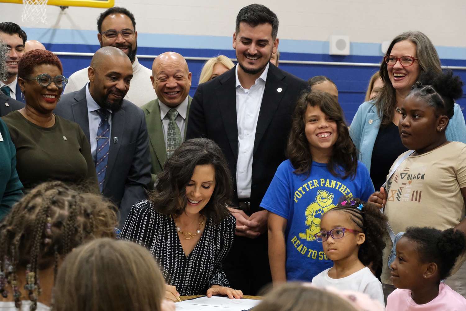 Gov. Whitmer, Sen. Camilleri, and local leaders at the signing of the K-12 education budget in Flint on Monday, Oct. 13, 2025. 
