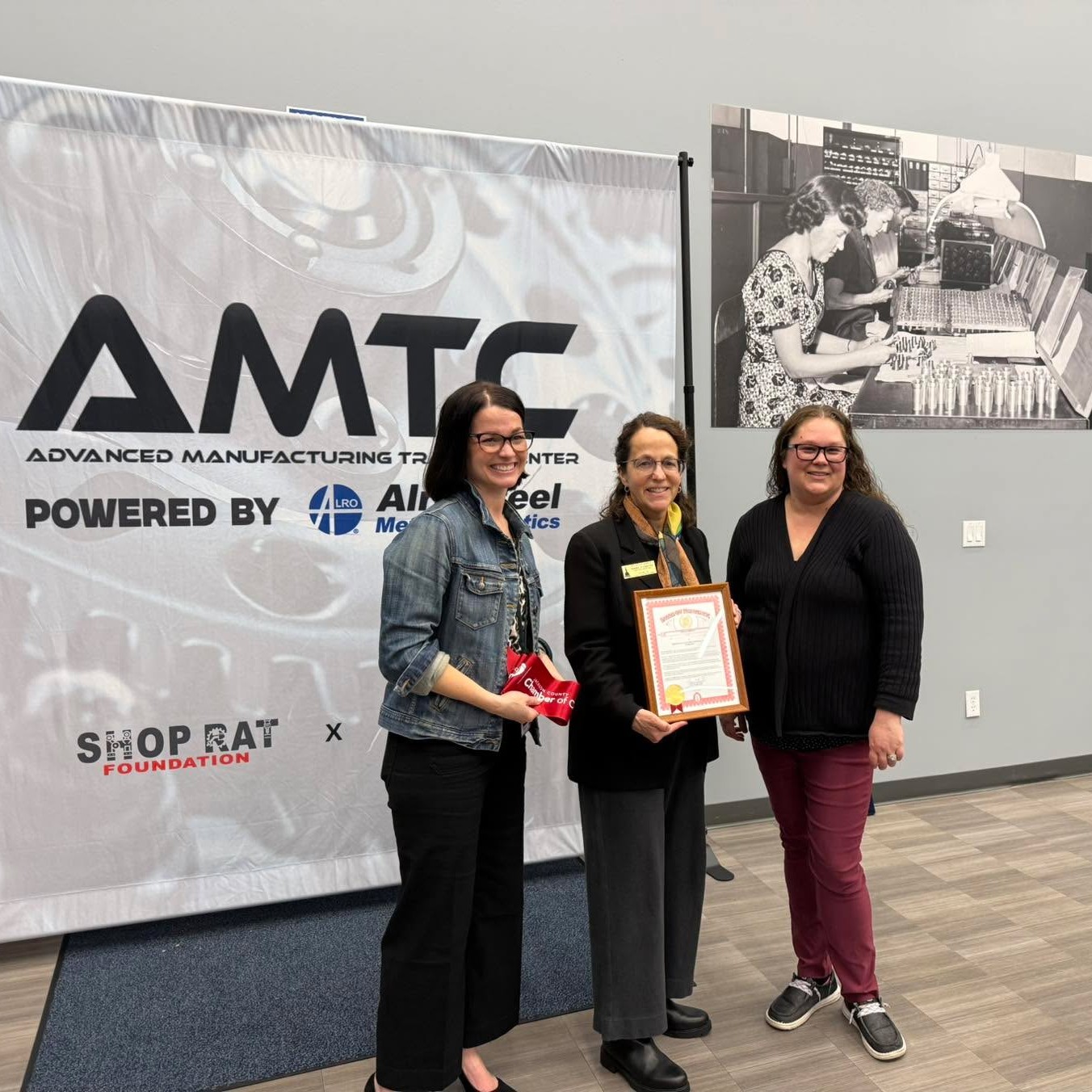 Team Shink awarding a tribute to Advanced Manufacturing Training Center