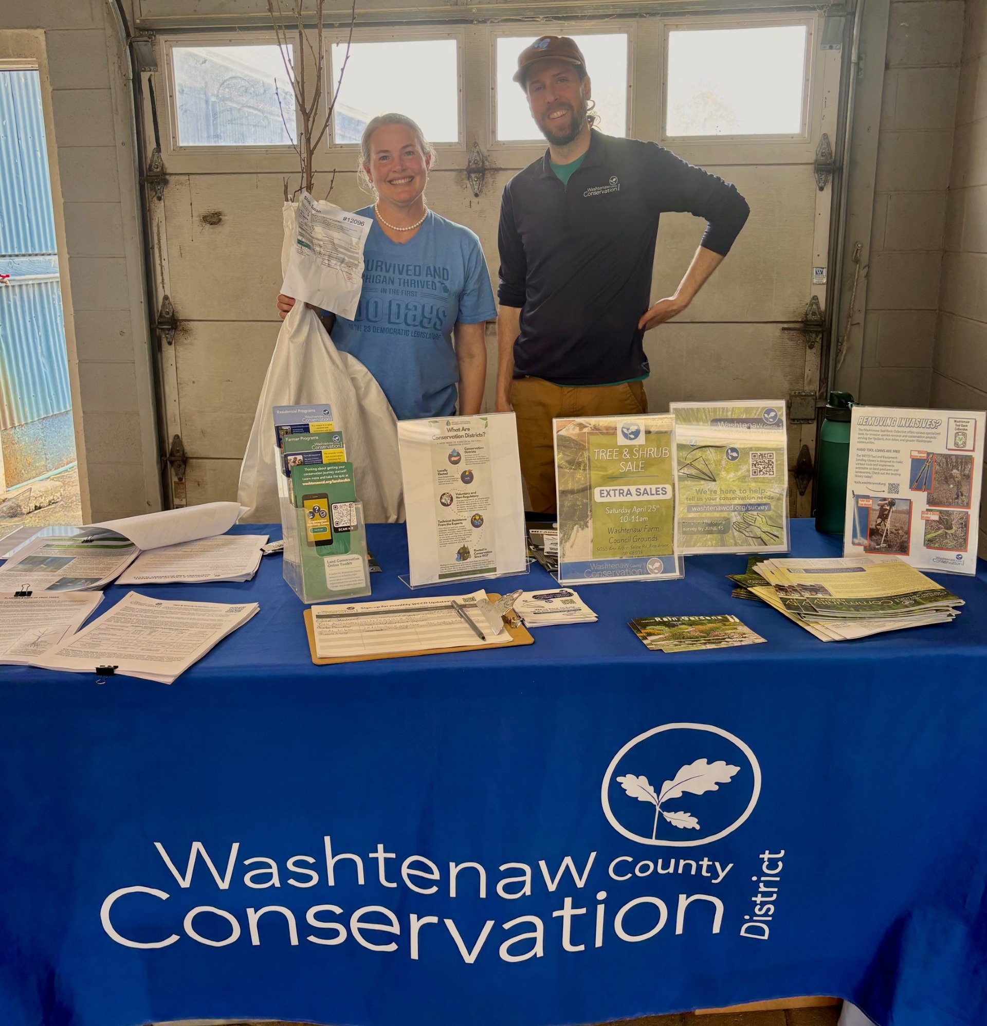 Senator Shink at a table with the The Washtenaw County Conservation District providing information