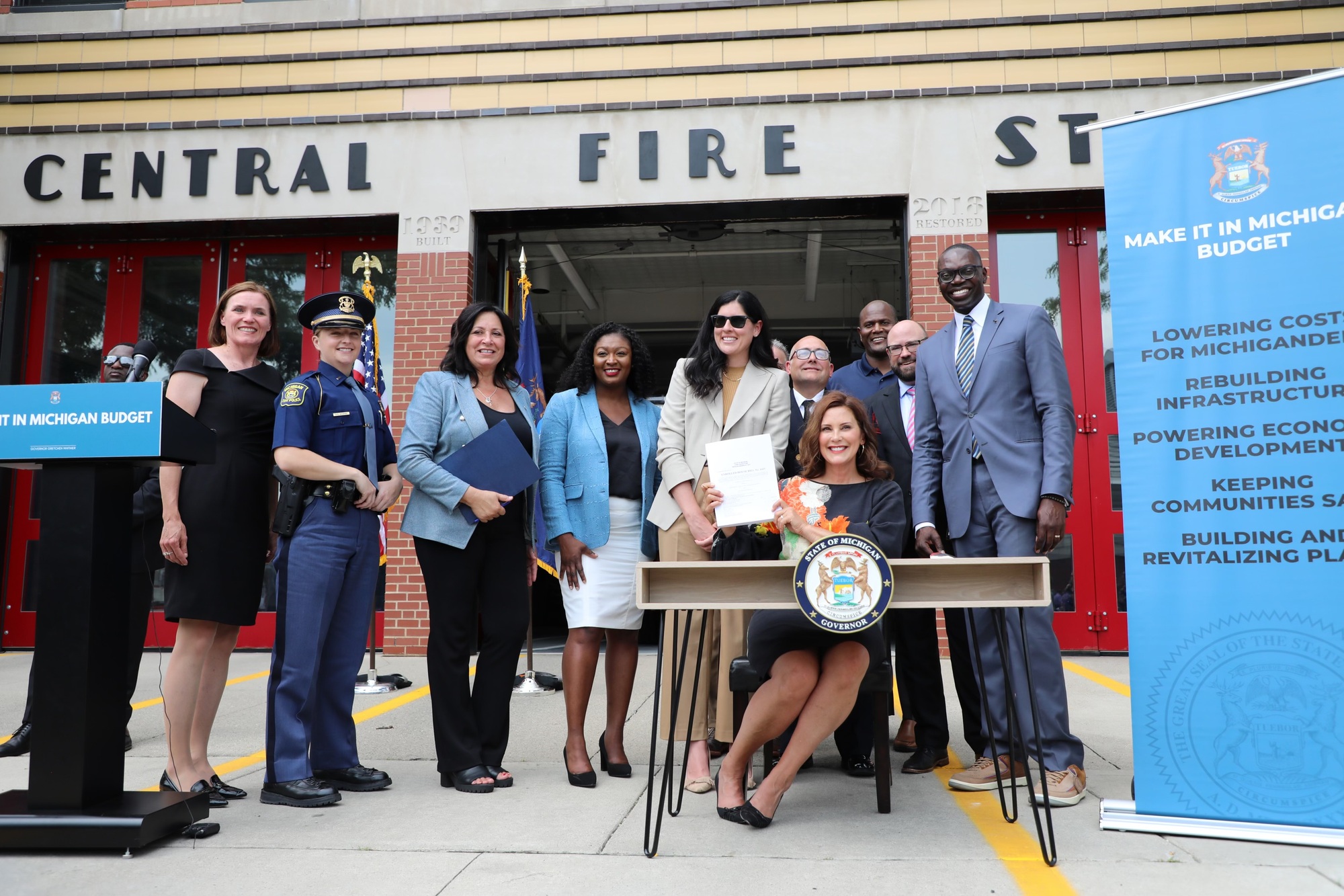 Senate Majority Leader Winnie Brinks and Senate Appropriations Chair Sarah Anthony join Gov. Whitmer, Lt. Governor Gilchrist, members of the Michigan House of Representatives and local first responders in Wyandotte at the signing of a historic budget for Fiscal Year 2024. 