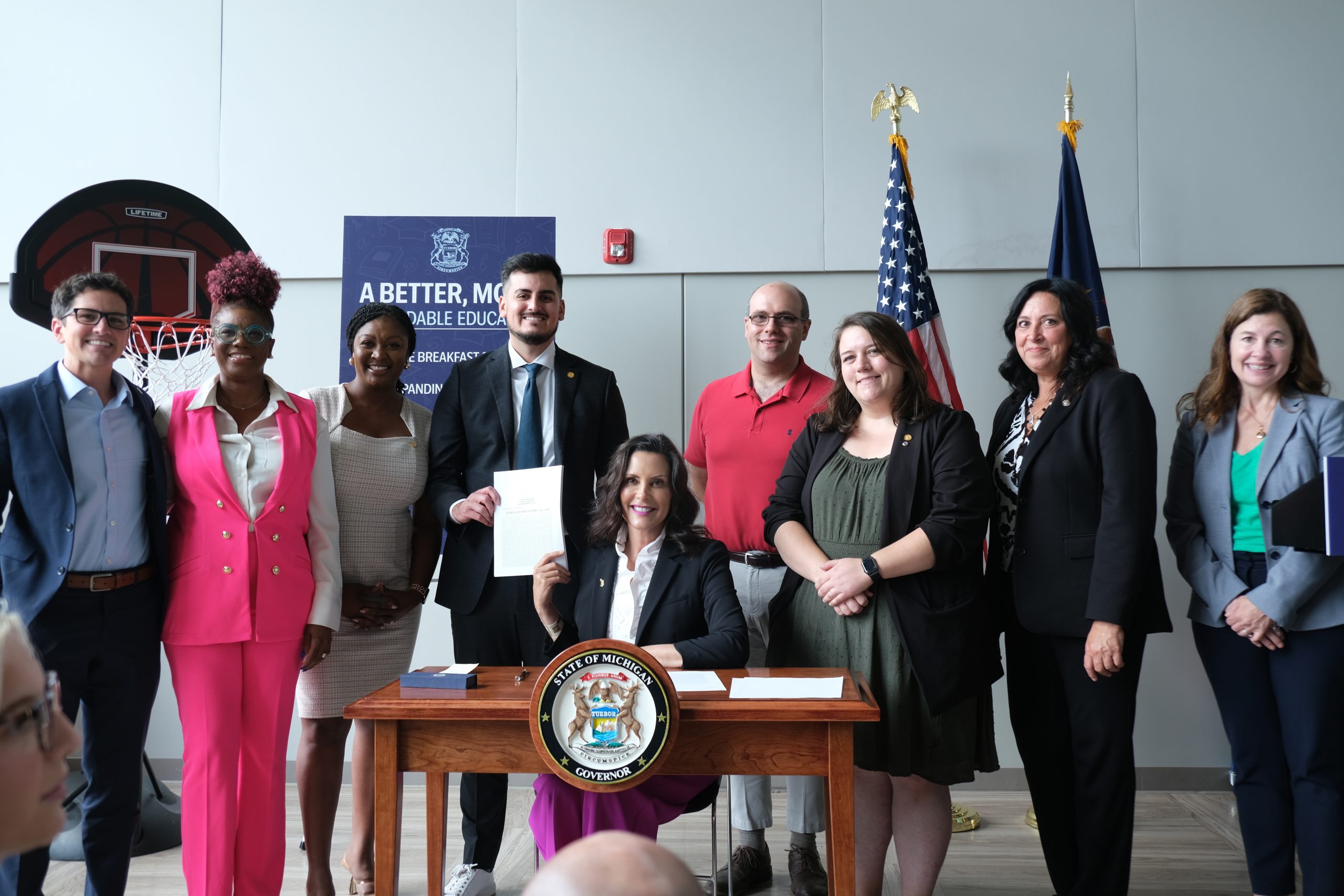 Senate Appropriations Chair Sarah Anthony, Senate Appropriations Pre-K-12 Subcommittee Chair Darrin Camilleri and Sens. John Cherry and Kristen McDonald Rivet pose with Gov. Gretchen Whitmer and other state officials at the Education Budget signing on July 23, 2024. 